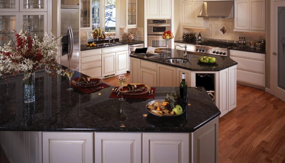 Polished black granite countertops in American kitchen.