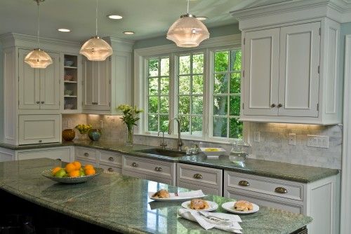 Green granite countertops in house kitchen.